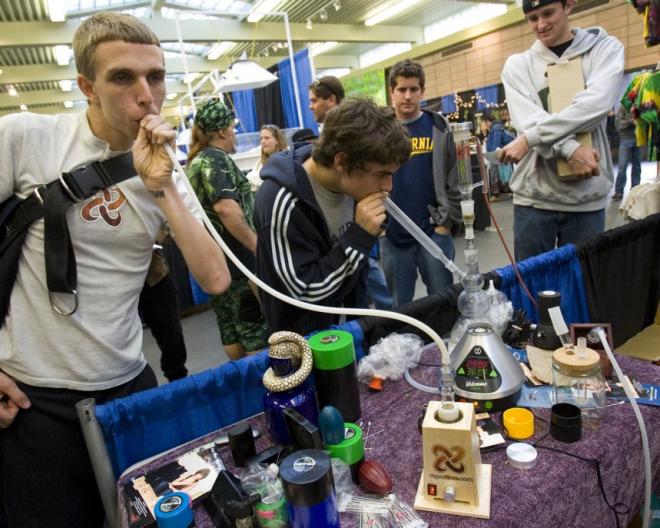 158233-young-men-smoke-from-a-vapor-pipe-and-water-pipe-at-the-the-wonders-of